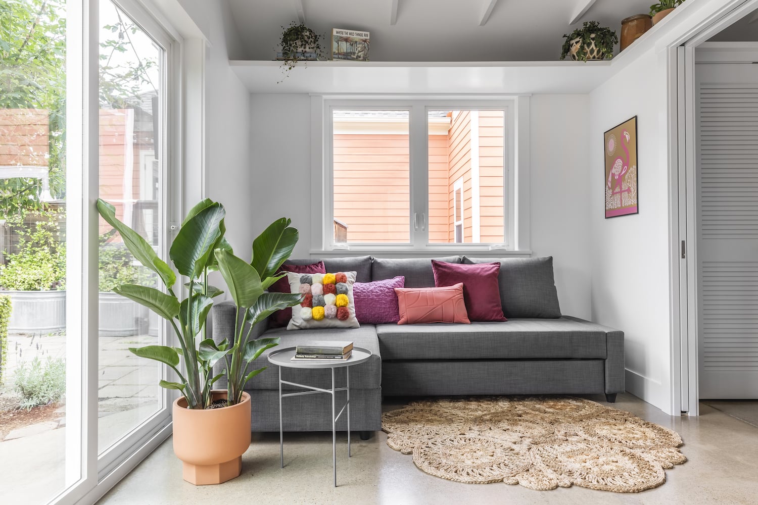 Living Room with Sleeper Sofa, Sliding and Pocket Doors, Polished Concrete Floor