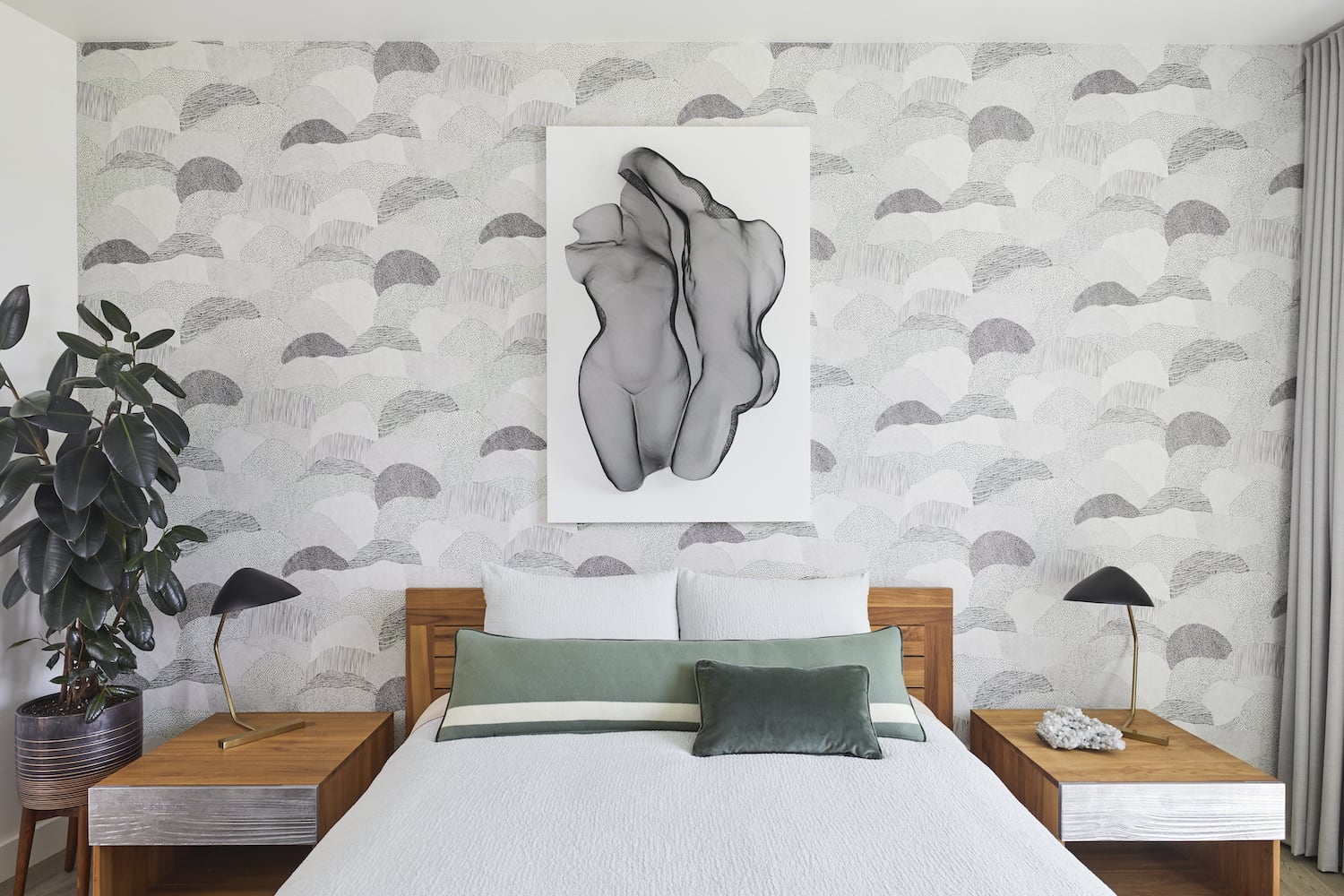 Owner bedroom with matching nightstands, wallpaper and metal mesh artwork