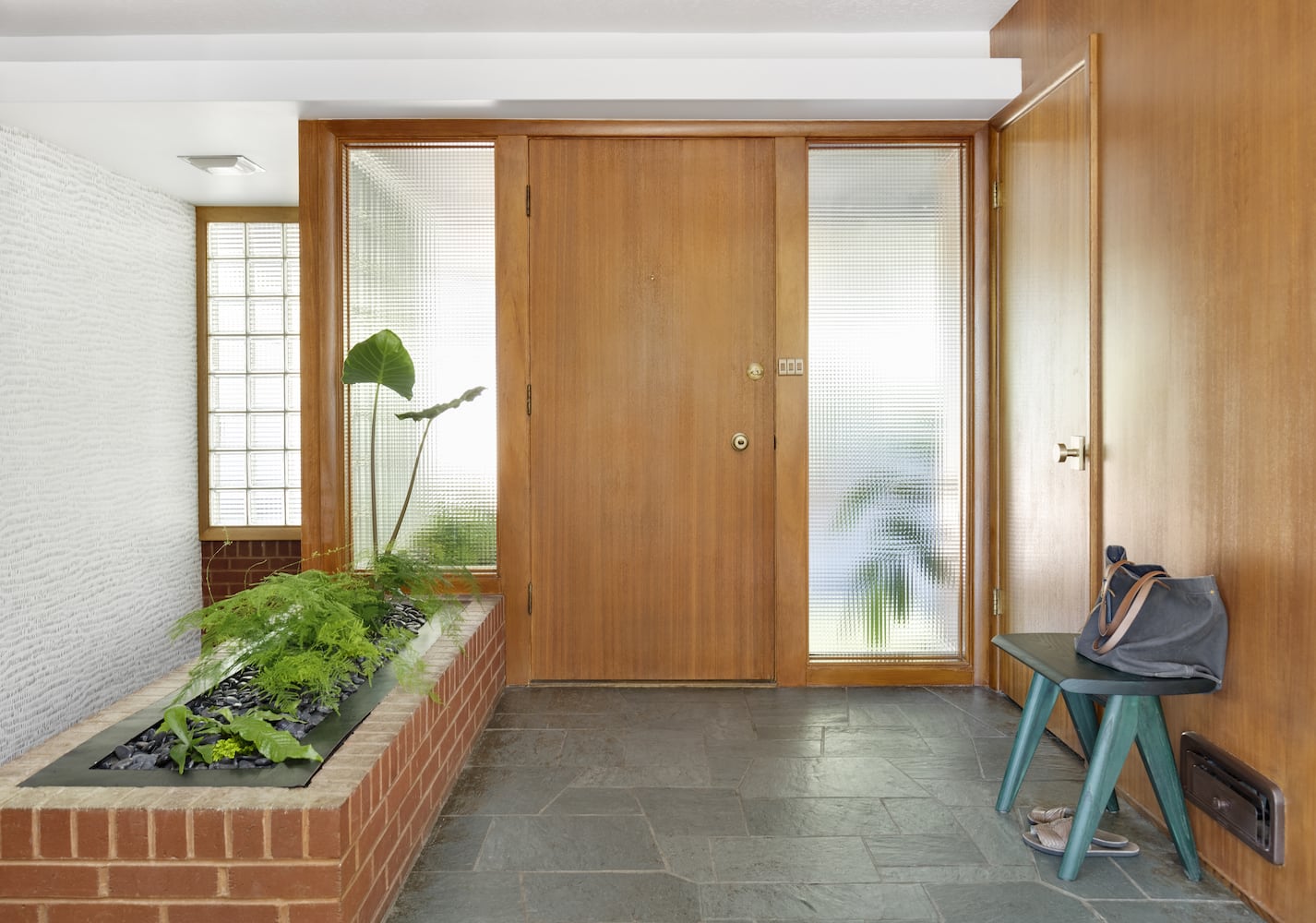 Front entry with built-in planter, green slate tile, mahogany, waffle glass