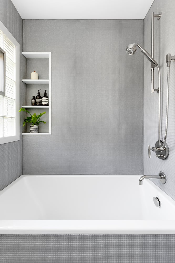 Bathroom shower tub with gray micro mosaic tile, polished nickel fixtures