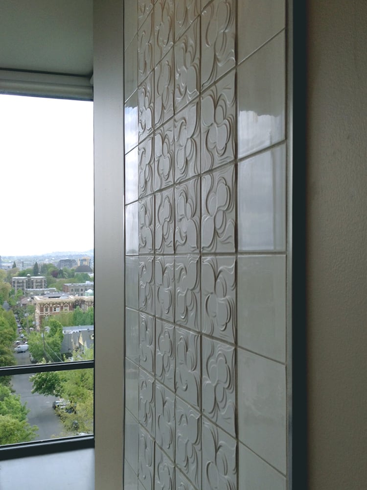 Clayhaus ceramic patterned textured tile on wall of upper floor outdoor balcony