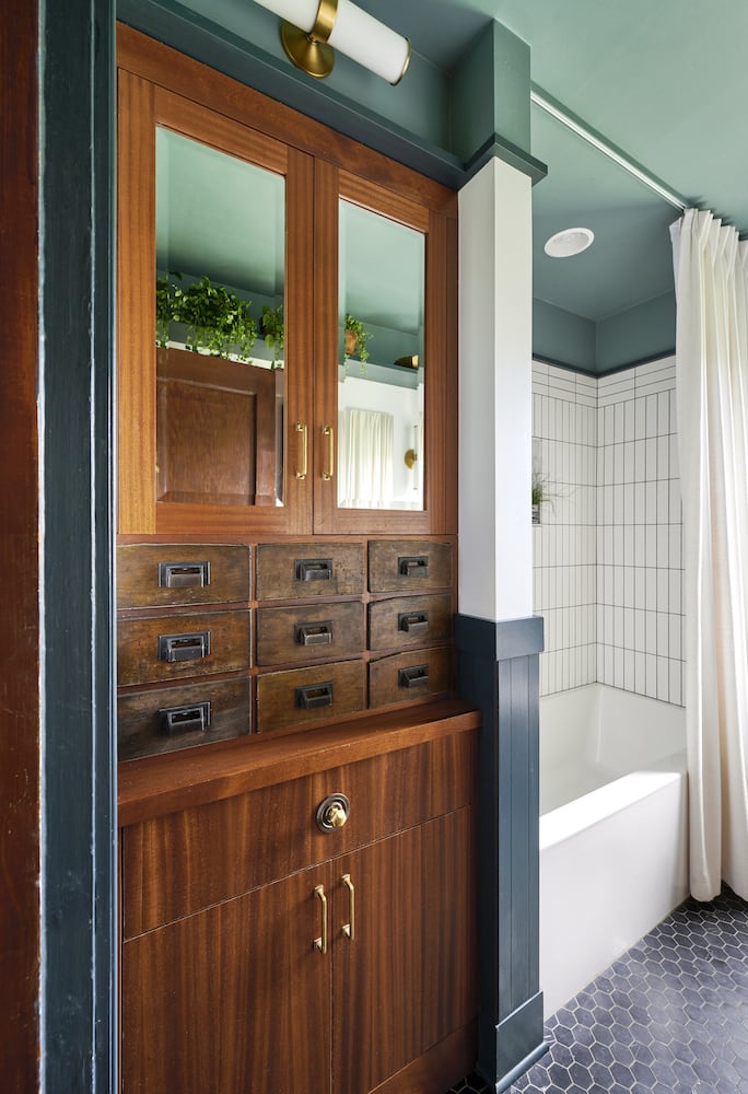 Remodeled Portland bathroom with sapele cabinets and salvaged hardware drawers