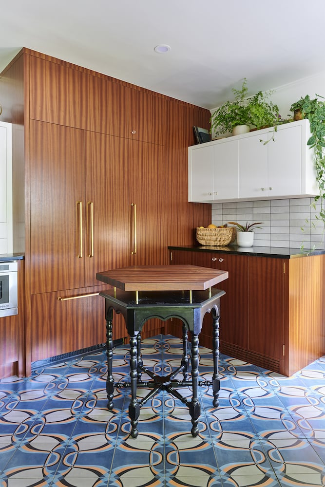 Remodeled kitchen with patterned floor tile, sapele cabinets, panel fridge