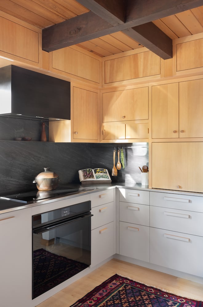 Corner of kitchen remodel with a series of well-designed cabinet spaces