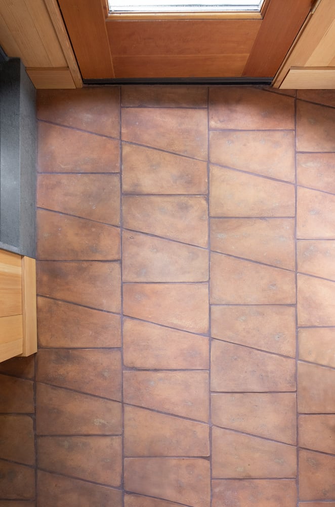 Geometric modern tierra field tile creates shapes and patterns on this bathroom floor