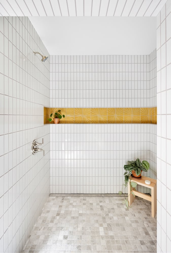 Wraparound shower niche in walk-in shower with polished nickel plumbing fixtures