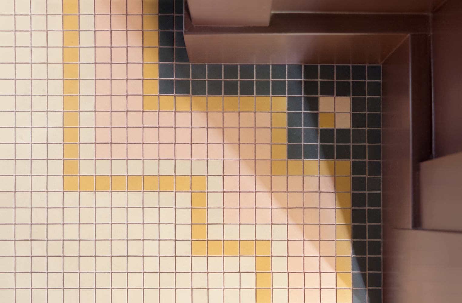 Meticulously crafted custom tile flooring patterns on a bathroom remodel