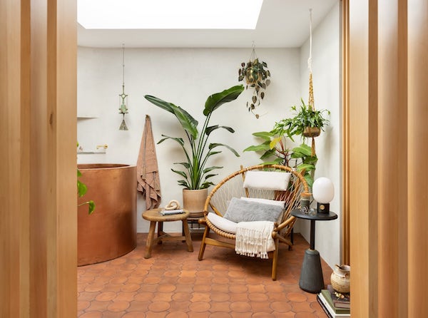 Stunning midcentury holistic home spa renovation with tierra floor tile, copper tub