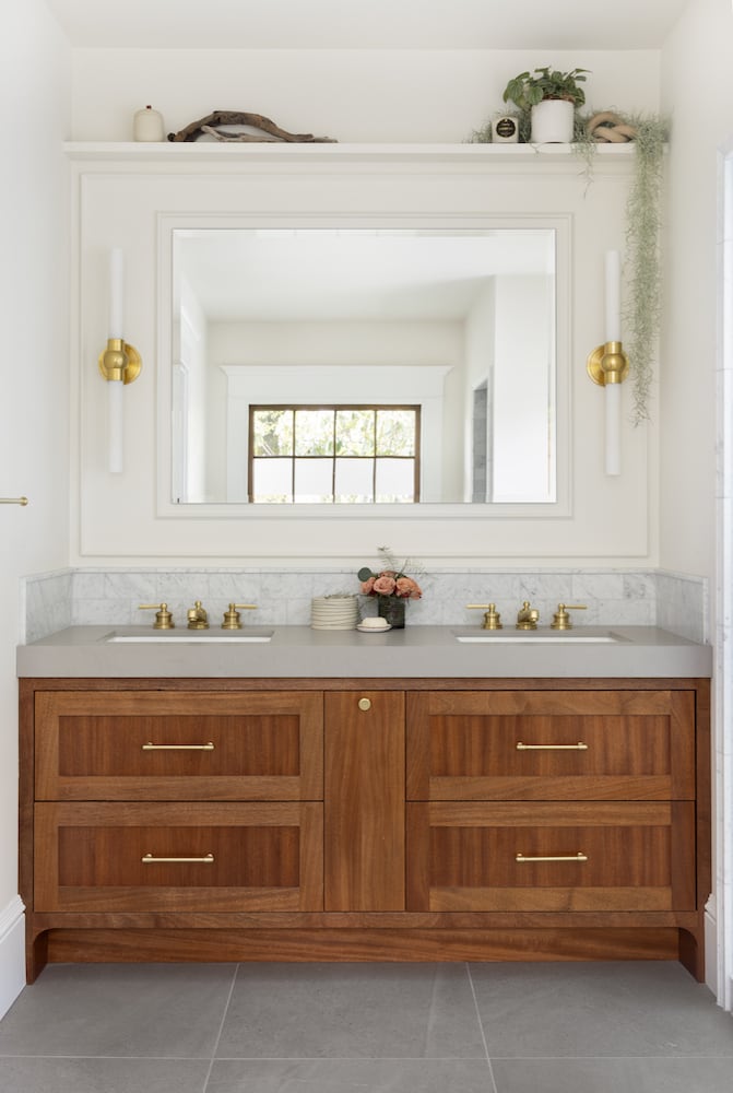 Portland interior designed dual sinks with Cornwall by Hudson Valley vanity sconces
