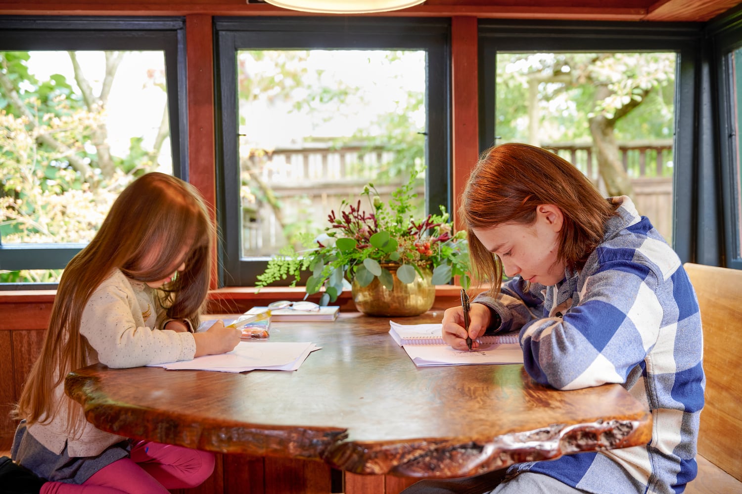 Children sit and draw at a creative live edge kitchen nook countertop table