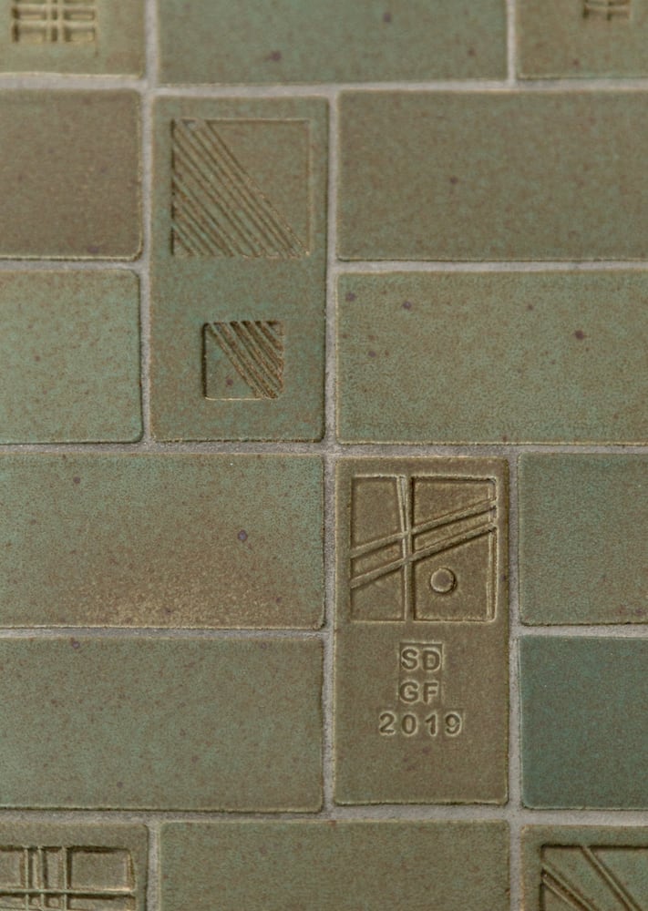 Handmade green ceramic tile with initials stamped for Glen Ford and Stephanie Dyer