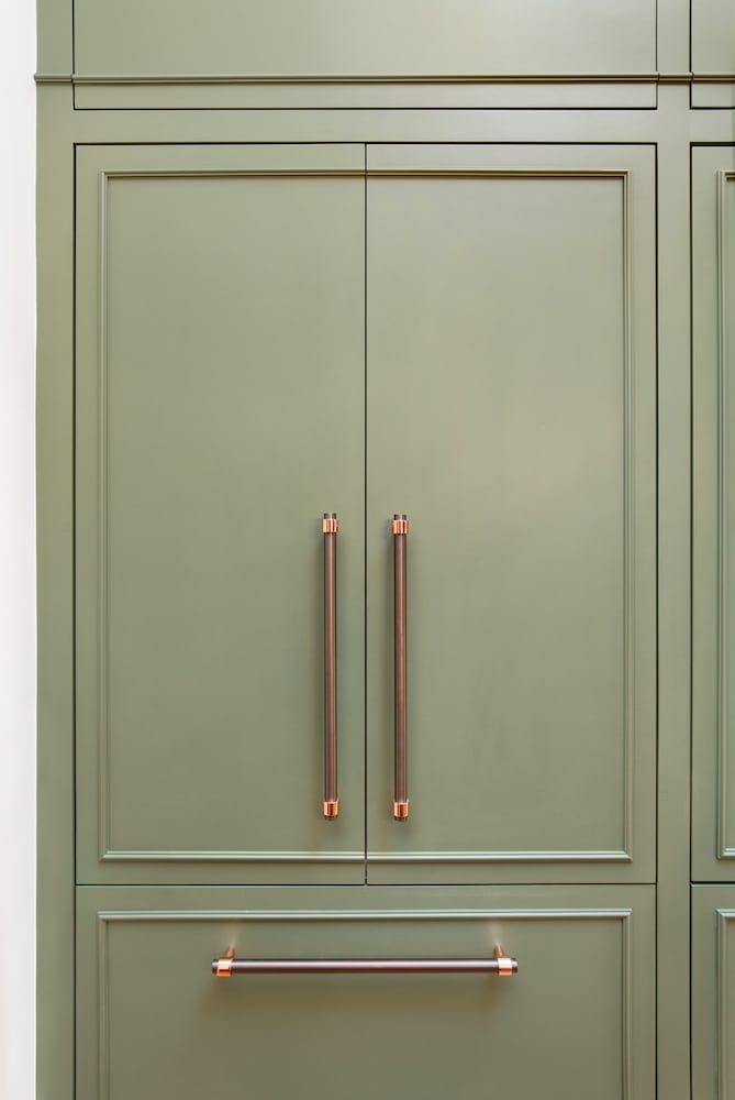Custom kitchen pantry with larder, closed doors with polished pulls