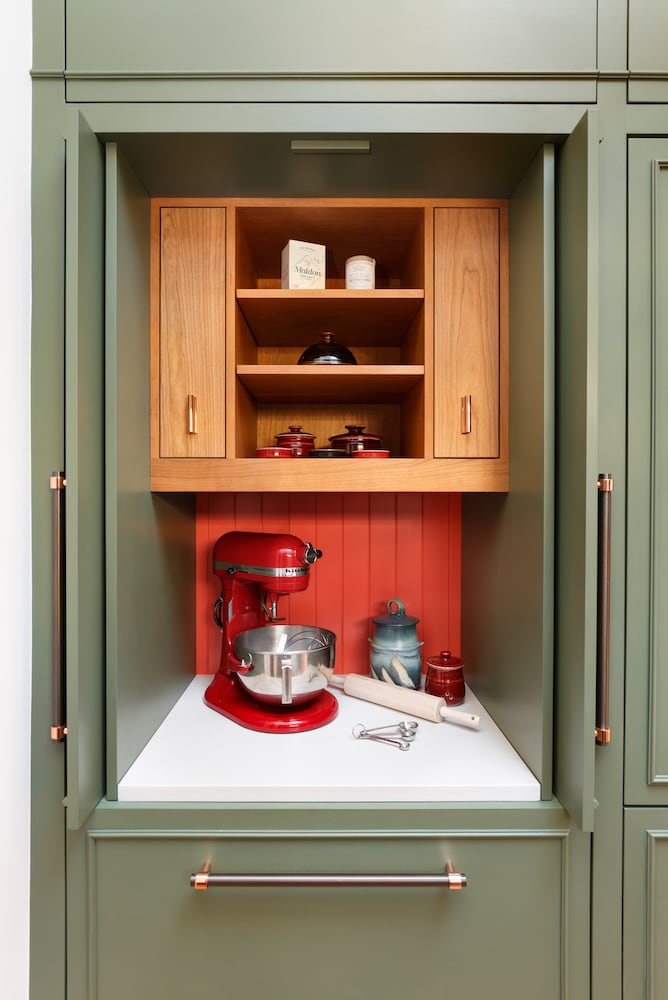 Kitchen pantry with larder, open doors revealing custom designed niche