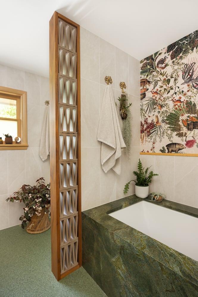 Green epoxy flooring matches the granite bathtub surround with squid towel hangers