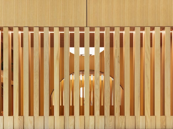 Expert attention to detail on custom wood slat trim, minimalist interior design