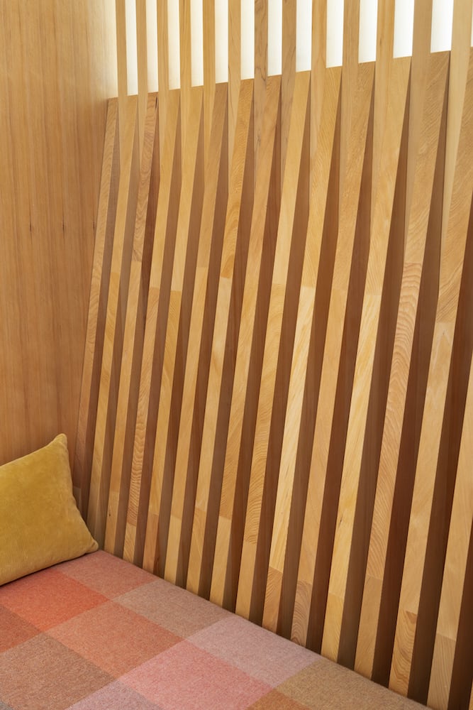 Detail of angled wood slats in perfect alignment creating an exquisite modern design