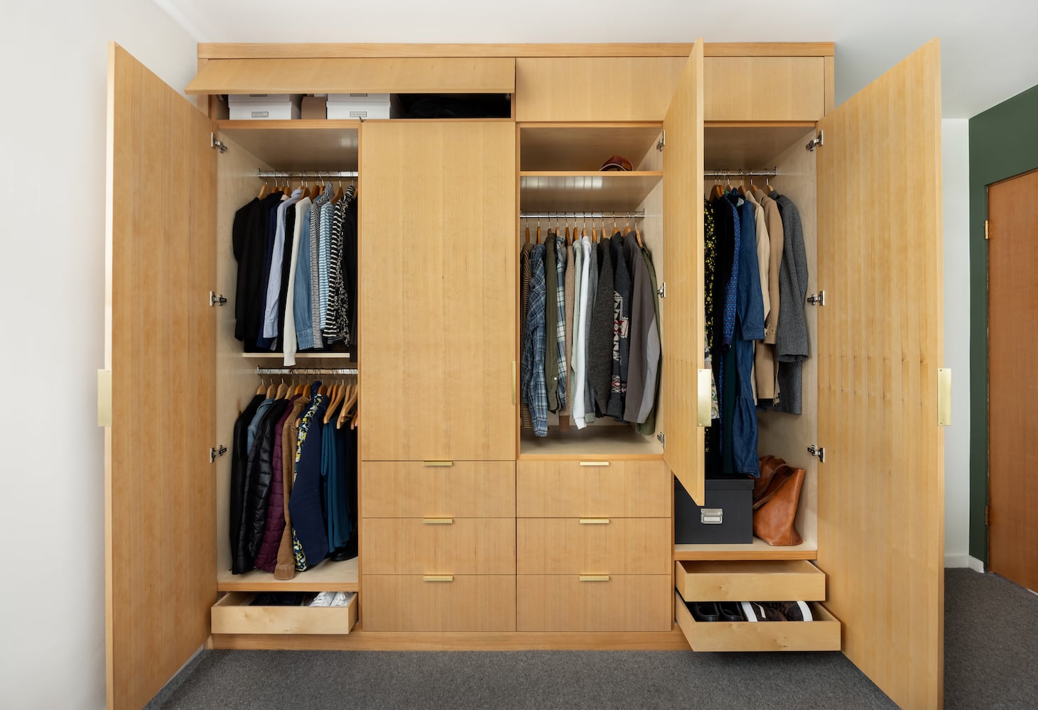 Custom closet with doors revealed to open in a number of ways, clever design